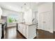 Kitchen island with stainless steel dishwasher and sink with granite countertops at 2140 Colvin Nw Ct, Atlanta, GA 30318
