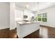 Kitchen features white cabinets, granite countertops, stainless steel appliances and pendant lighting at 2140 Colvin Nw Ct, Atlanta, GA 30318