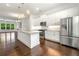 Kitchen with white cabinets, granite countertops, stainless steel appliances with an island at 2140 Colvin Nw Ct, Atlanta, GA 30318