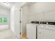 Laundry room featuring a washer, dryer, and wire shelving for storage at 2140 Colvin Nw Ct, Atlanta, GA 30318