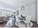 Open-concept living and dining areas feature hardwood floors, neutral tones, and ample natural light at 2140 Colvin Nw Ct, Atlanta, GA 30318