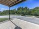 View from the covered patio showcasing a paved surface and green landscape at 2140 Colvin Nw Ct, Atlanta, GA 30318