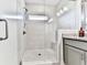 Walk-in shower with glass door and tile surround at 2140 Colvin Nw Ct, Atlanta, GA 30318