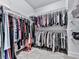 Walk-in closet with built-in shelving and ample storage space at 2140 Colvin Nw Ct, Atlanta, GA 30318