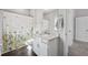 Bright bathroom with granite vanity top, decorative shower curtain and wood look flooring at 3116 Quantum Ln, Atlanta, GA 30341