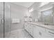Bright bathroom features a double vanity with granite countertop and a tiled glass shower enclosure at 3116 Quantum Ln, Atlanta, GA 30341