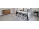 Bedroom with wrought iron bed frame, rug, dresser, and side tables for a cozy feel at 3116 Quantum Ln, Atlanta, GA 30341