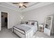 Inviting bedroom with tray ceilings, a cozy bed, and a neutral palette at 3116 Quantum Ln, Atlanta, GA 30341