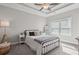 Inviting bedroom with a tray ceiling, cozy bed, and ample natural light at 3116 Quantum Ln, Atlanta, GA 30341