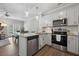 Modern kitchen featuring stainless appliances, subway tile backsplash, and light cabinetry at 3116 Quantum Ln, Atlanta, GA 30341