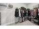 Walk-in closet with wire shelving and a garment rack with sections for light and dark clothing at 3116 Quantum Ln, Atlanta, GA 30341