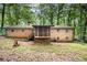 Brick home with a screened-in porch and a fenced backyard at 505 Samaritan Dr, Cumming, GA 30040