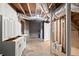 Unfinished basement with cabinets, exposed beams, and concrete flooring at 505 Samaritan Dr, Cumming, GA 30040