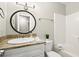 Well-lit bathroom featuring granite countertops, a large mirror, and a combined shower and tub at 505 Samaritan Dr, Cumming, GA 30040