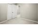 Comfortable bedroom with double closets and neutral carpeting; view of the hallway at 505 Samaritan Dr, Cumming, GA 30040