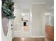 Home foyer with light neutral walls, trim and tile floors with a view into an eat-in kitchen area at 505 Samaritan Dr, Cumming, GA 30040