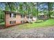 Charming brick home features a well-manicured front yard and a two-car garage at 505 Samaritan Dr, Cumming, GA 30040