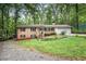 Charming brick home features a well-manicured front yard and a two-car garage at 505 Samaritan Dr, Cumming, GA 30040