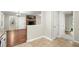 Eat-in kitchen adjacent to large living area showing neutral walls, hardwood and tile flooring at 505 Samaritan Dr, Cumming, GA 30040