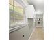 Bright laundry room with storage cabinets and a window allowing natural light at 505 Samaritan Dr, Cumming, GA 30040