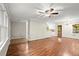 Open-concept living area with hardwood floors seamlessly connects to the kitchen and dining spaces, offering plenty of light at 505 Samaritan Dr, Cumming, GA 30040
