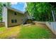 Spacious backyard featuring a deck, patio and mature trees, offering great outdoor living at 5137 Allison Way, Sugar Hill, GA 30518