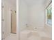 Bathroom featuring a large soaking tub and separate shower stall at 5137 Allison Way, Sugar Hill, GA 30518