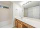 Bathroom featuring a large mirror, a vanity with a sink and a shower at 5137 Allison Way, Sugar Hill, GA 30518