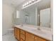 Bathroom with double vanity, large mirror, and lots of lighting at 5137 Allison Way, Sugar Hill, GA 30518