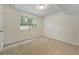 Cozy bedroom features a window that offers natural light and outdoor views at 5137 Allison Way, Sugar Hill, GA 30518