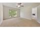 This bedroom is filled with natural light and has neutral carpet and white walls at 5137 Allison Way, Sugar Hill, GA 30518