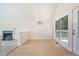 Open dining area featuring tile floors, a chandelier, and views of the fireplace at 5137 Allison Way, Sugar Hill, GA 30518