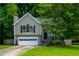 Charming two-story home features a manicured lawn, attached garage and beautiful landscaping at 5137 Allison Way, Sugar Hill, GA 30518