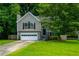 Charming home with a two-car garage, landscaped yard and inviting front entry at 5137 Allison Way, Sugar Hill, GA 30518