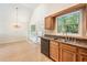 Kitchen with granite countertops, tile flooring and dining nook at 5137 Allison Way, Sugar Hill, GA 30518