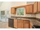 Kitchen featuring granite countertops, wood cabinets, and an eat-in breakfast area at 5137 Allison Way, Sugar Hill, GA 30518