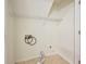 Practical laundry room with ample space for appliances and shelving for storage at 5137 Allison Way, Sugar Hill, GA 30518