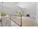 Bright living room with large windows, a vaulted ceiling, fireplace and neutral carpet at 5137 Allison Way, Sugar Hill, GA 30518