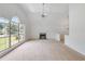 Spacious living room features vaulted ceilings, a fireplace, and ample natural light at 5137 Allison Way, Sugar Hill, GA 30518