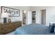 Stylish bedroom with modern decor, a large bed, and views into other rooms at 5415 Trescott Path, Cumming, GA 30028