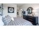 Nicely decorated bedroom with a comfortable bed, and stylish decor at 5415 Trescott Path, Cumming, GA 30028