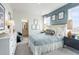 Charming bedroom featuring stylish decor, a comfortable bed, and an ensuite bathroom at 5415 Trescott Path, Cumming, GA 30028