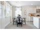 Bright dining area with windows, modern decor, and easy access to the kitchen at 5415 Trescott Path, Cumming, GA 30028