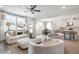 Spacious living area with open concept design connecting to kitchen and dining at 5415 Trescott Path, Cumming, GA 30028