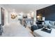 Open loft featuring a comfortable seating area and view of the staircase at 5415 Trescott Path, Cumming, GA 30028