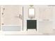 Guest bath featuring a niche with satin brass schluter and marble mosaic floor at 1111 Moreland Se Pl, Atlanta, GA 30316