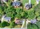 Aerial view of a residential neighborhood featuring mature trees and well-maintained yards at 1350 Rivershyre Pkwy, Lawrenceville, GA 30043