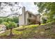 Exterior angle view of home showcasing deck and sprawling backyard at 1350 Rivershyre Pkwy, Lawrenceville, GA 30043