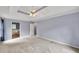 Bedroom featuring neutral carpet with an ensuite bathroom and bright natural light at 1350 Rivershyre Pkwy, Lawrenceville, GA 30043
