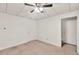 Bedroom with neutral carpet, a ceiling fan, and a walk-in closet at 1350 Rivershyre Pkwy, Lawrenceville, GA 30043